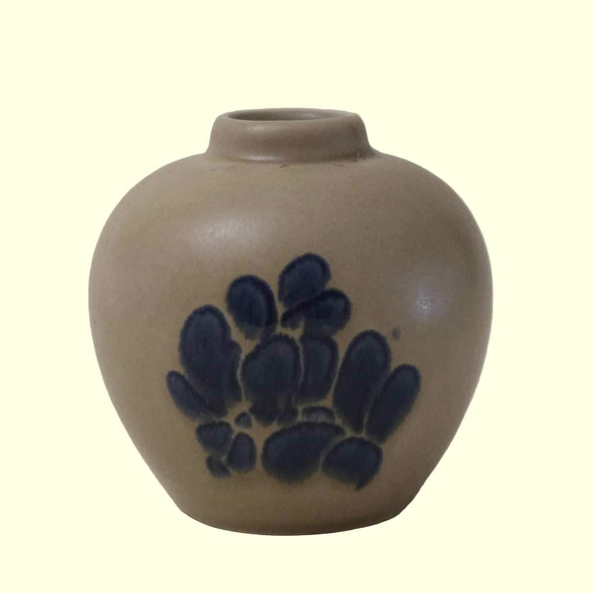 A beige and blue hand-painted Folk Art Potpourri Jar with a country-style design.