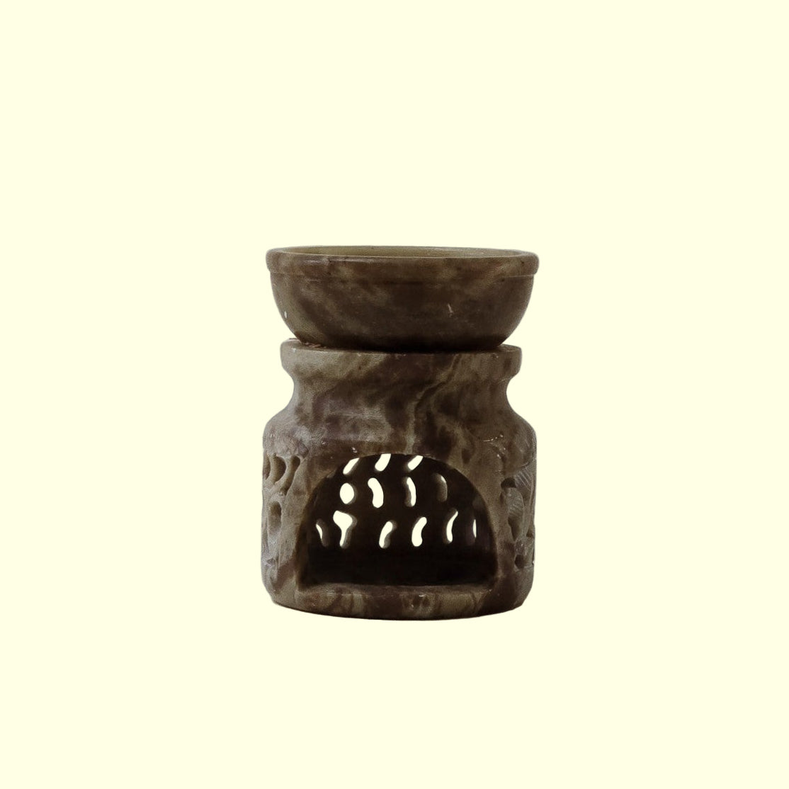 A brown marble oil diffuser with natural veining, featuring a minimalist design with a sleek, narrow neck and a round base.