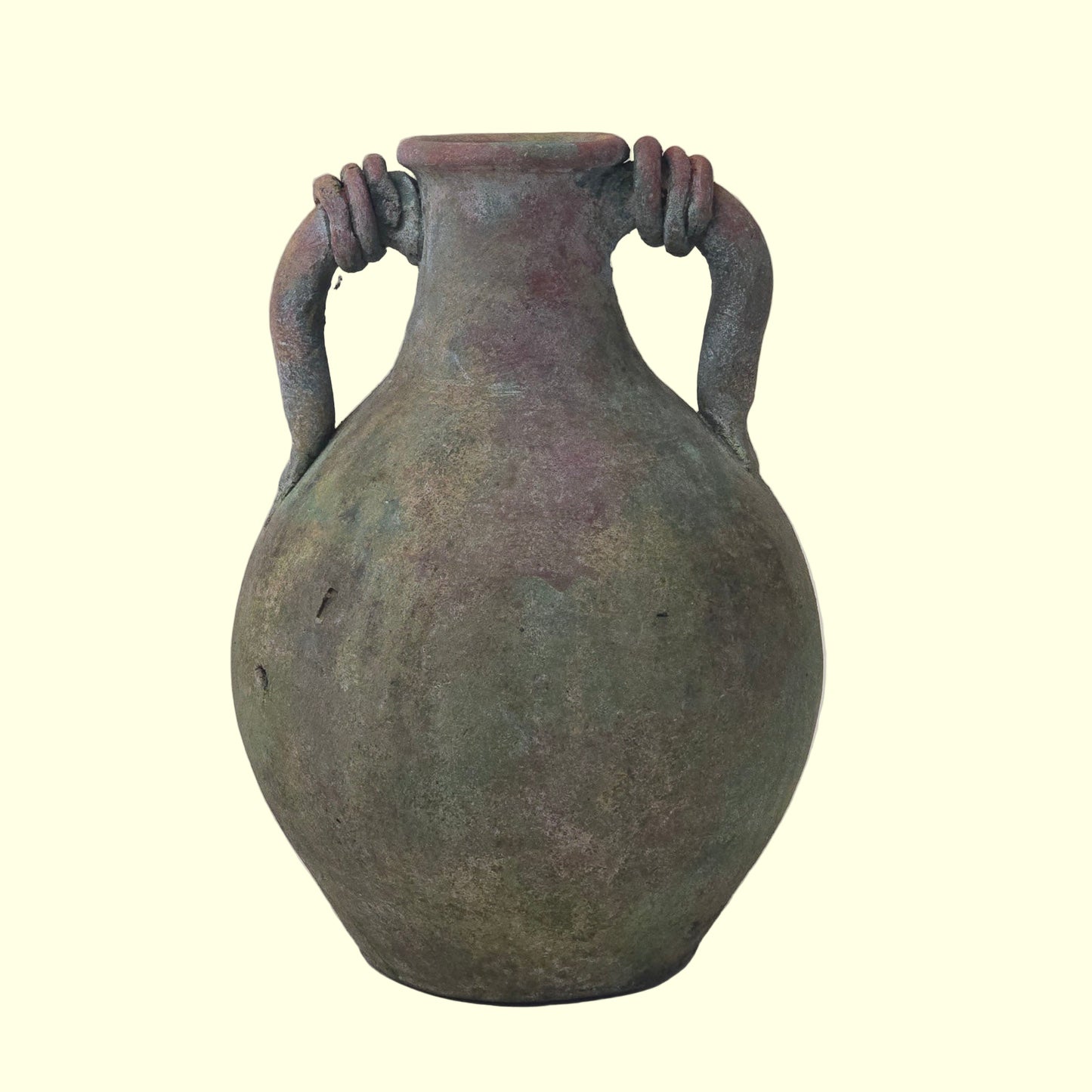 Ancient ceramic jar with handles on a plain background