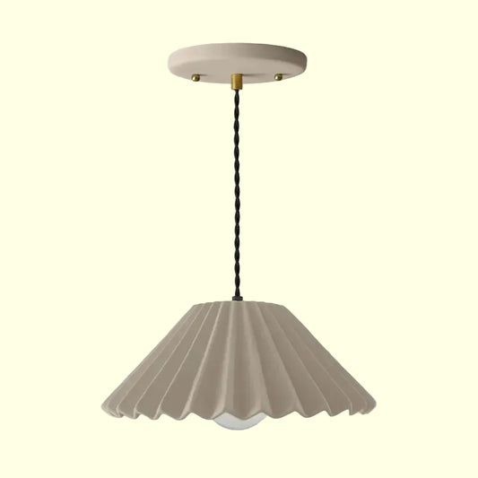 Beige pendant light with scalloped shade on a white background